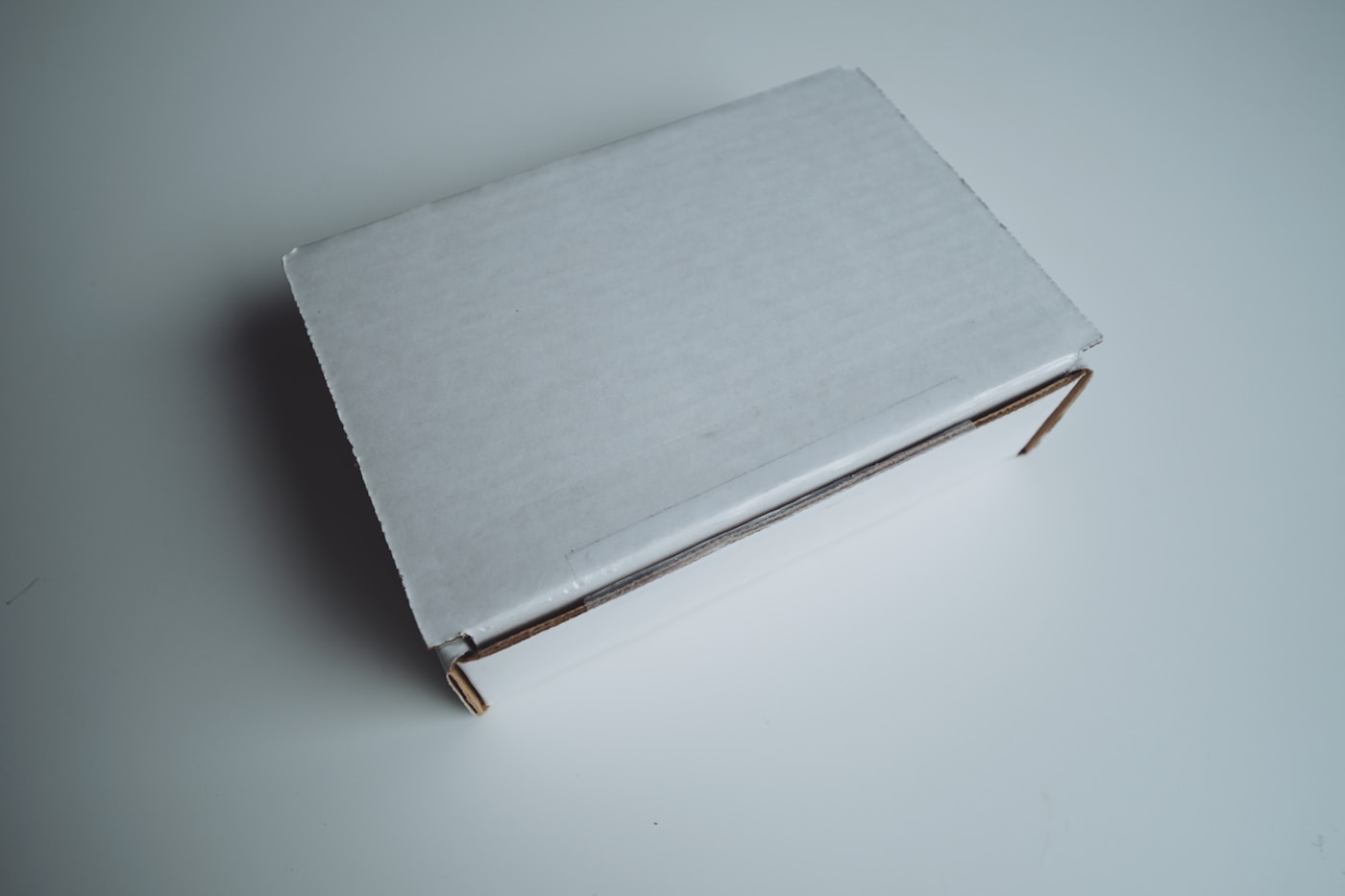 A discreet, unbranded white delivery box
