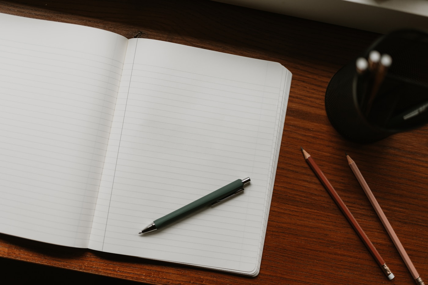 An open notebook and pen for a written care plan