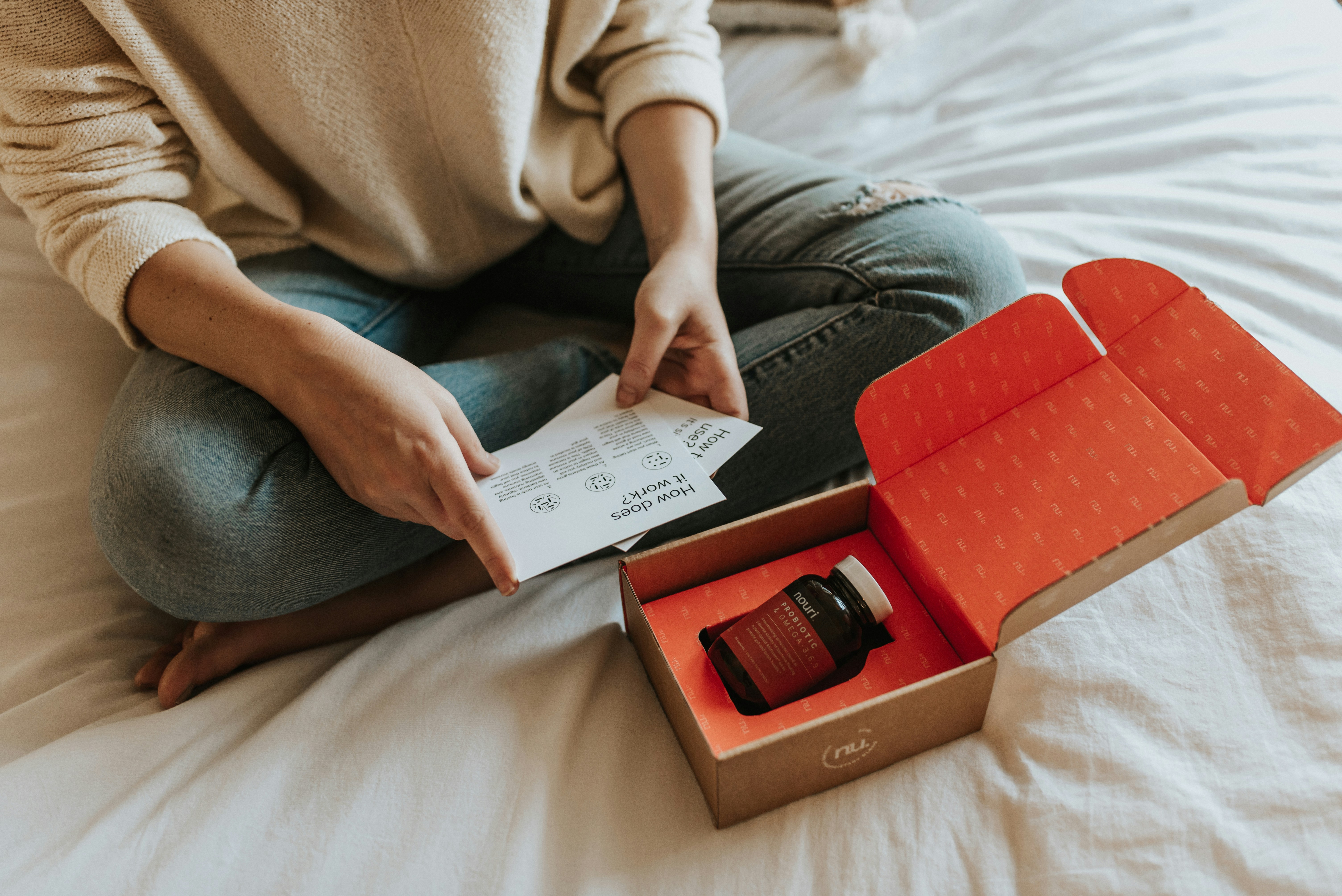 Person opening a delivery box and reading the included instructions